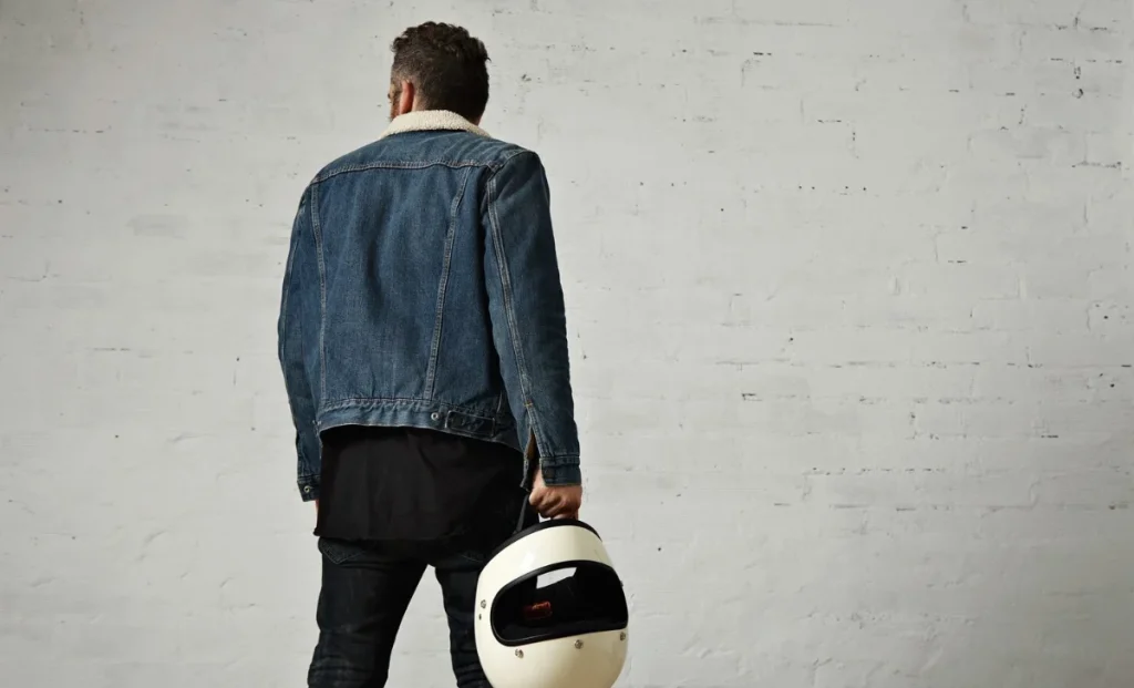 a man wearing a denim jacket