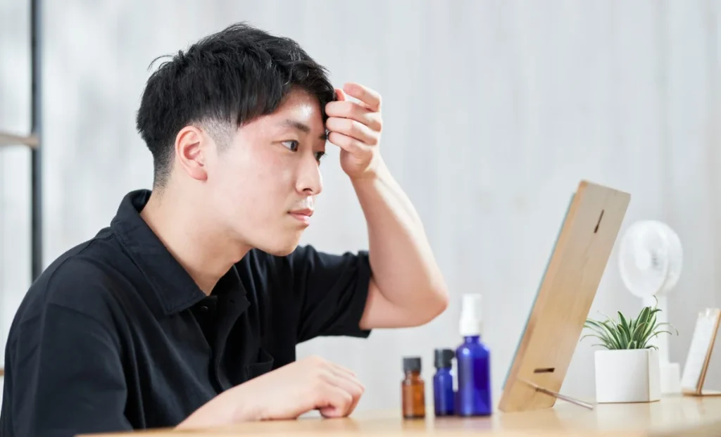 a man seeing himself in a mirror