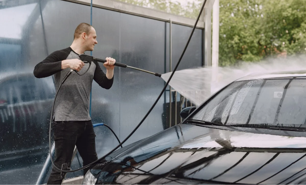 a man using pressure washer