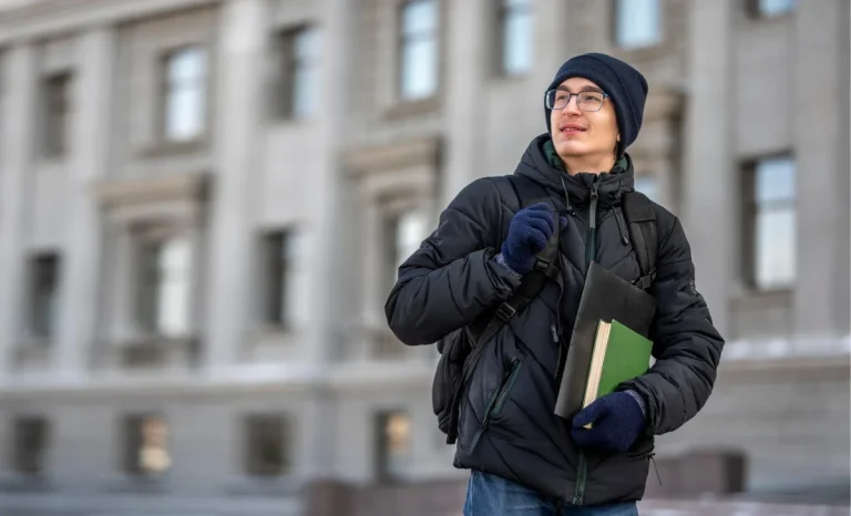 a boy in university holding books in hand