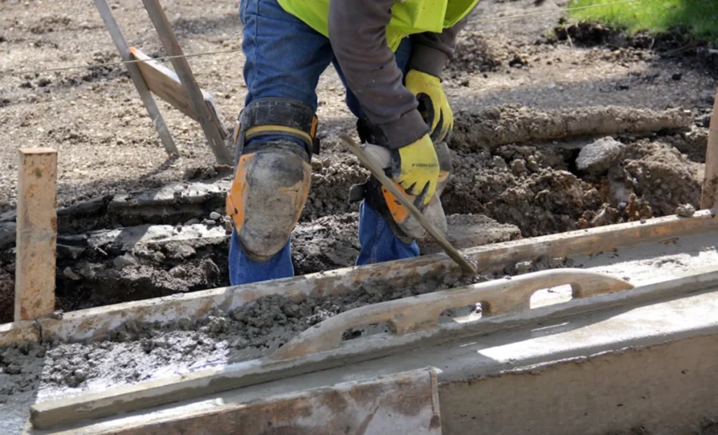 a constructor man plastering cement