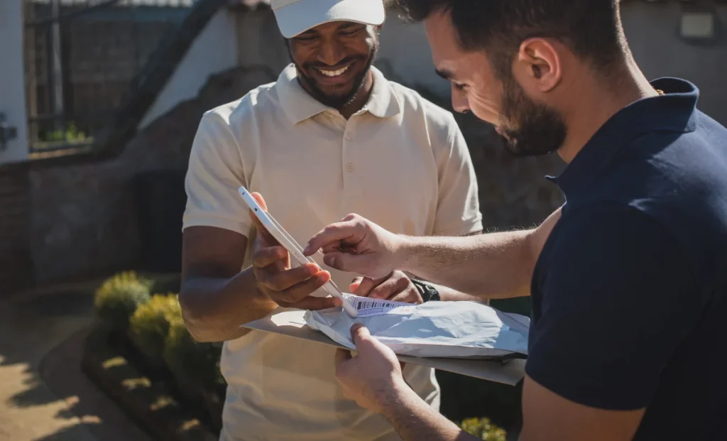 a courier man delivering a parcel