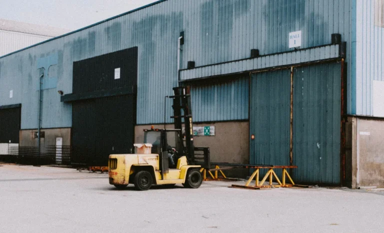 a man driving a forklift