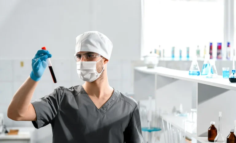 a man in lab testing chemicals