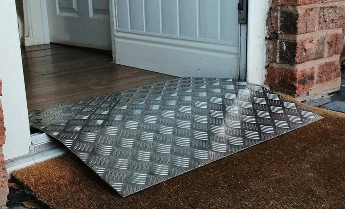 a piece of aluminium checker plate placed in the way of room