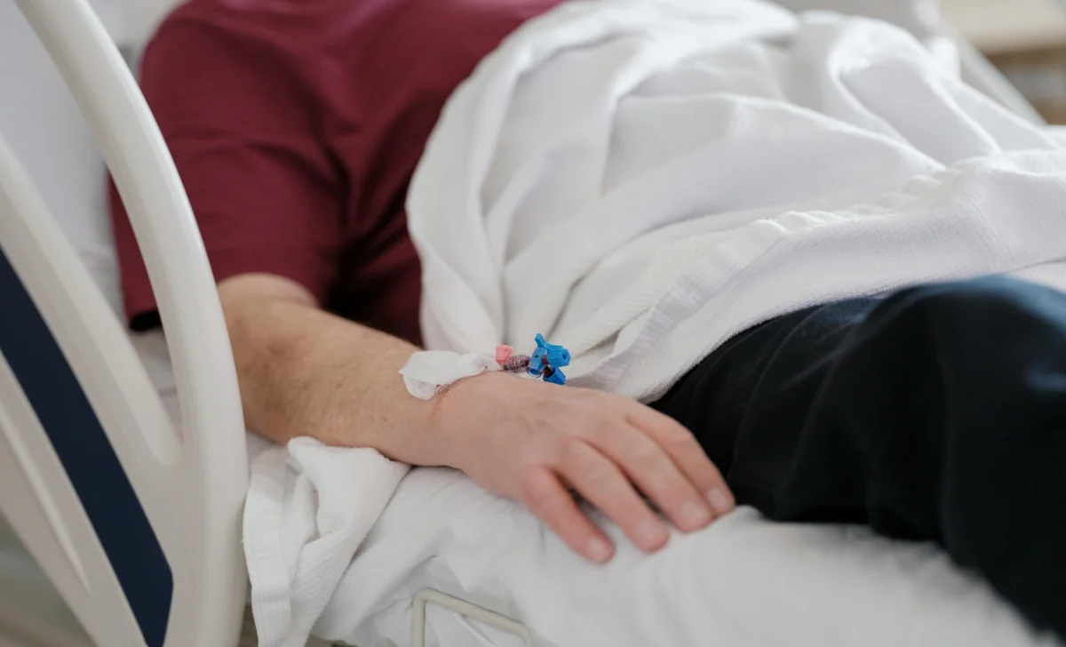 a man on bed in hospital