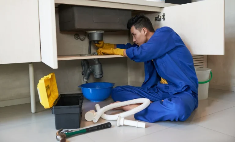a plumber fixing a pipe