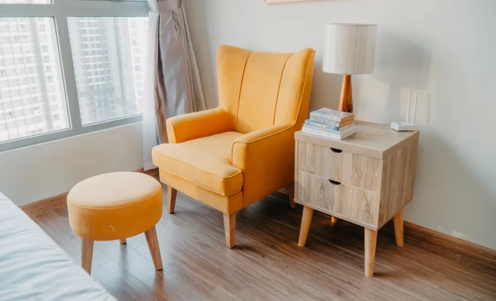 a yellow sofa in a cozy bedroom
