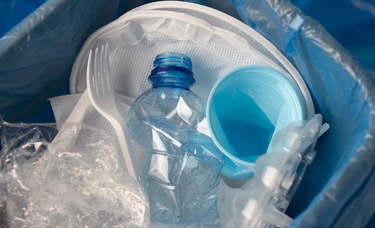 plastic bottle in a dust bin