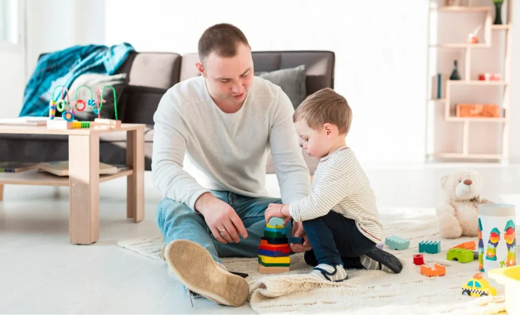 a man taking care of a kid