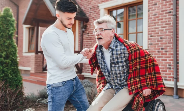 a boy helping a senior