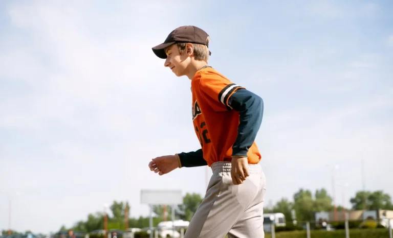 a boy wearing a sports shirt