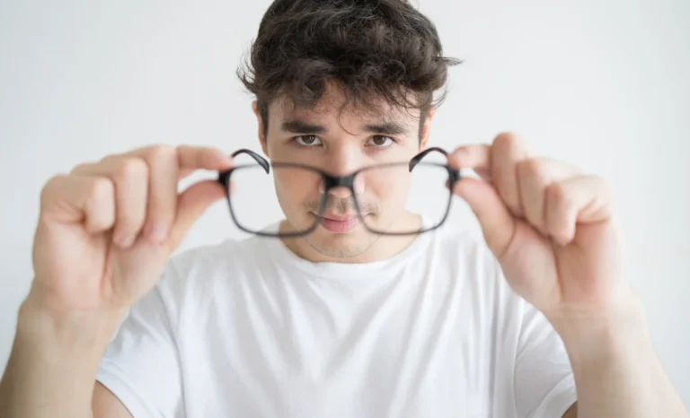 a man holding a glasses