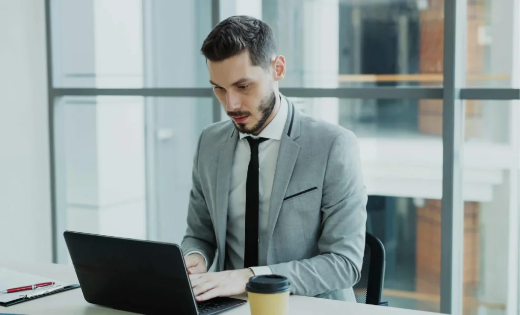 a professional man working on laptop