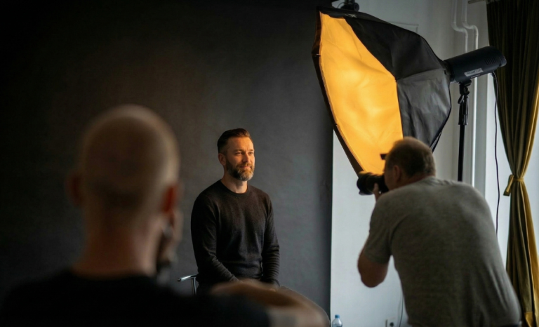 studio photographer in dark