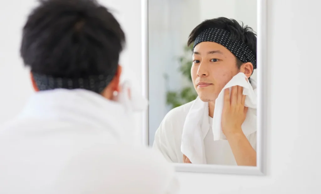 a man cleaning his face