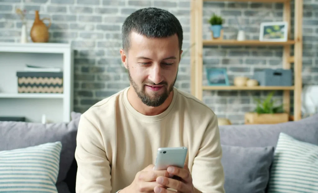 a young man using his phone