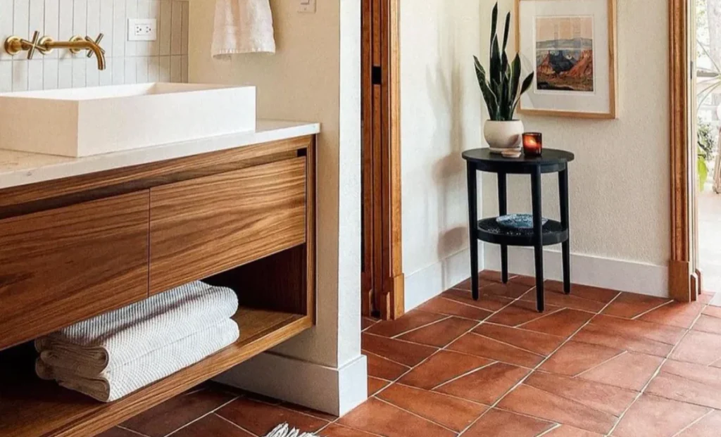 a bathroom with Cotto tiles