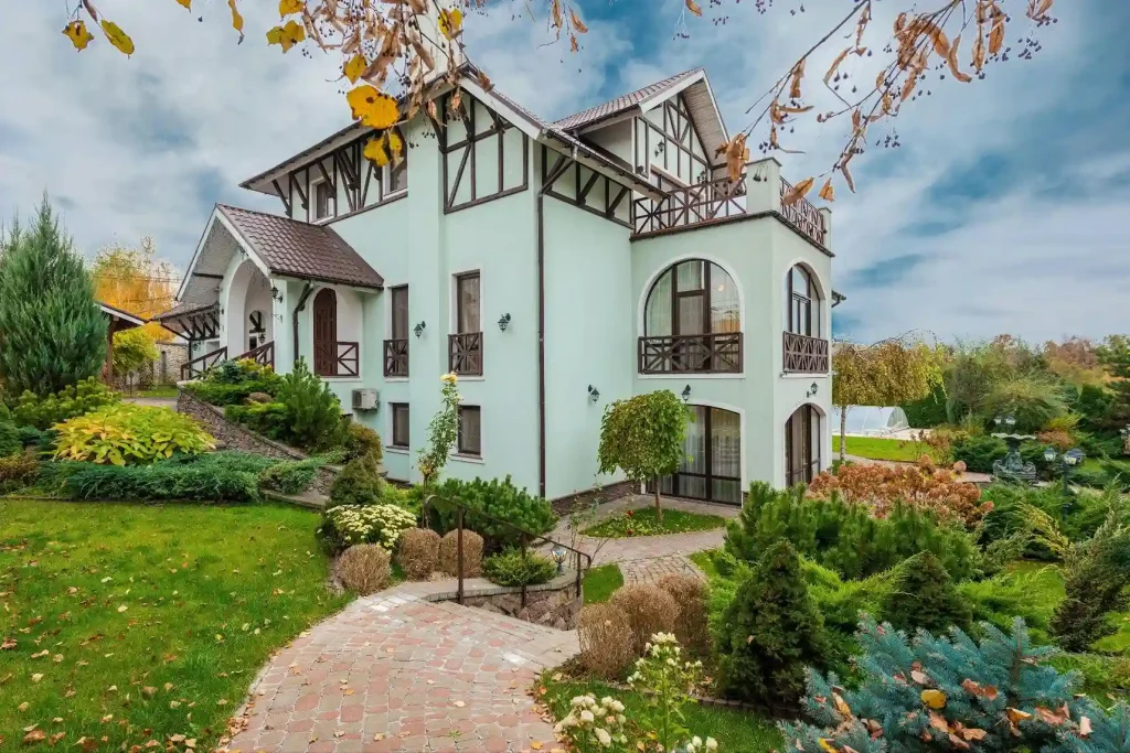 a big house with garden in the backyard