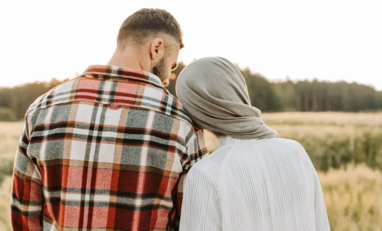 a happy couple in a a field