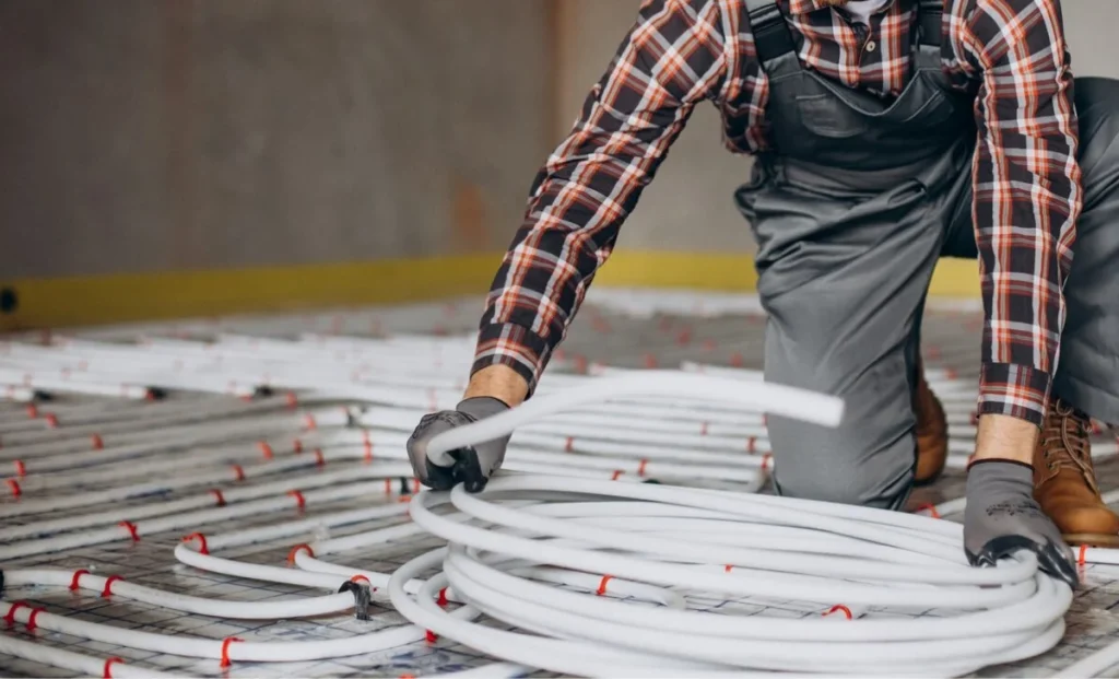 a man laying PEX pipe