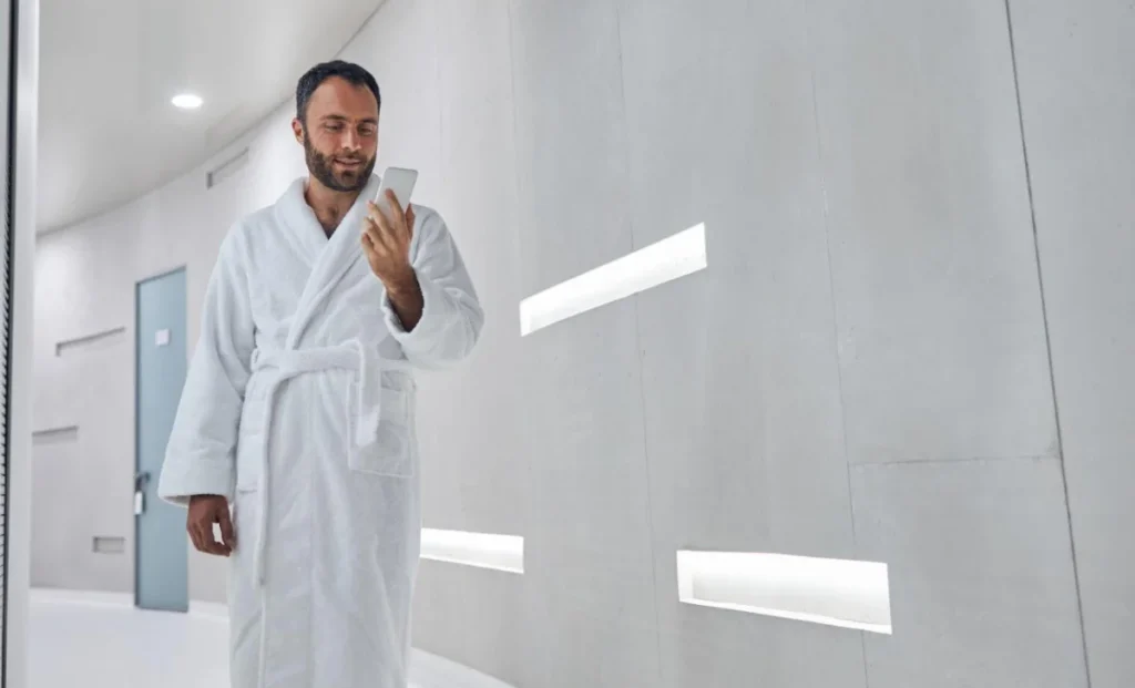 a man using phone in a wellness clinic
