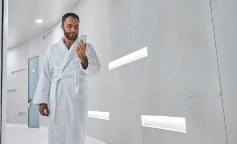 a man using phone in a wellness clinic