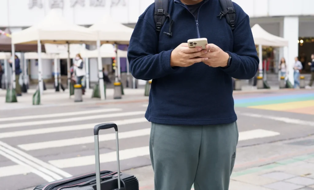 a traveler man using phone