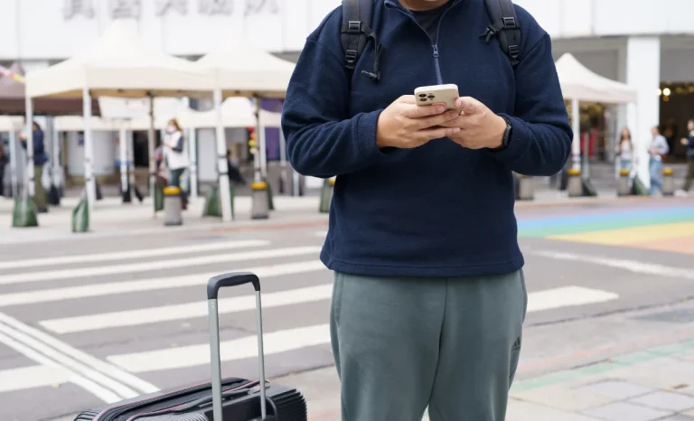 a traveler man using phone