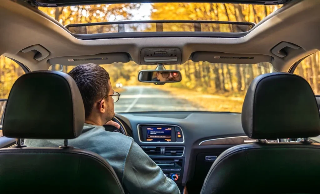 a man driving a car