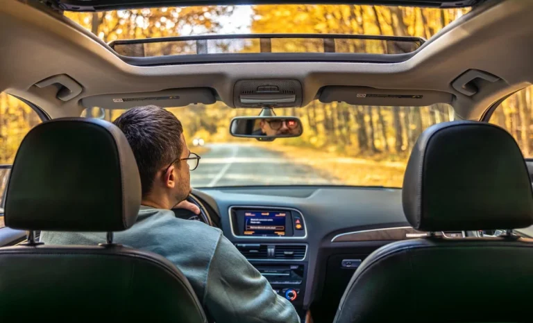 a man driving a car