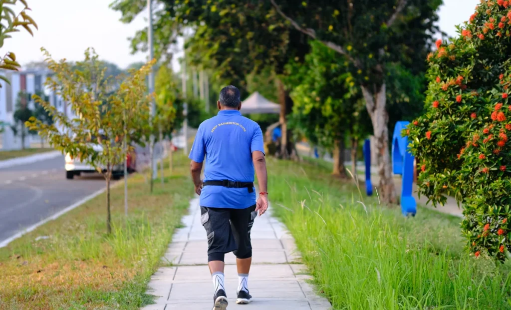 a man walking on the side of the road