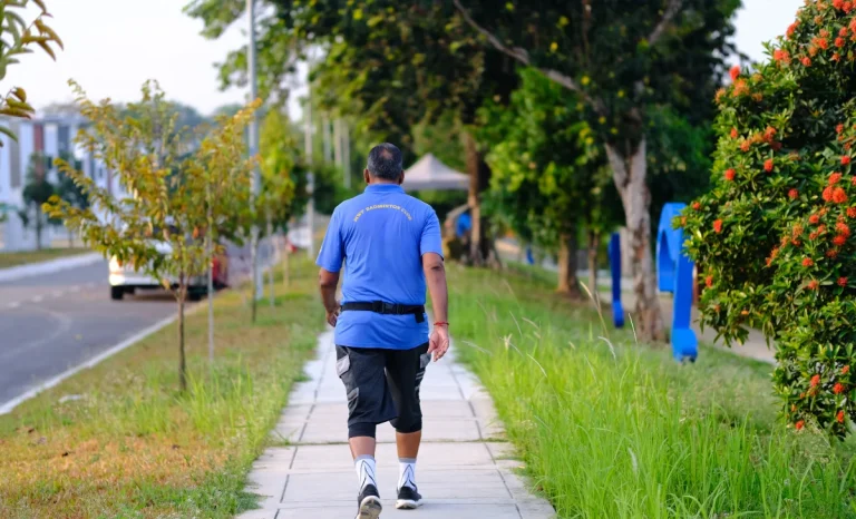 a man walking on the side of the road
