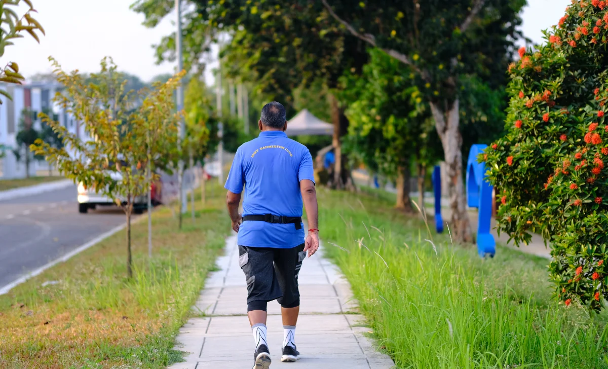 a man walking on the side of the road