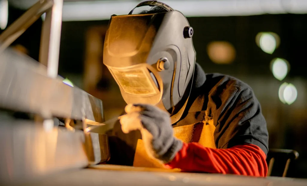 a man wearing a welding helmet