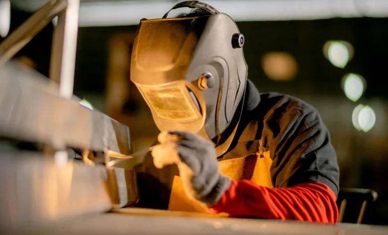 a man wearing a welding helmet