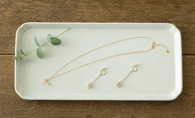 a necklace with two earrings