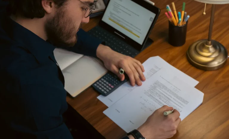 a student writing on paper
