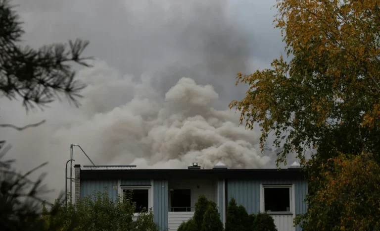 smoke rising from a burned house