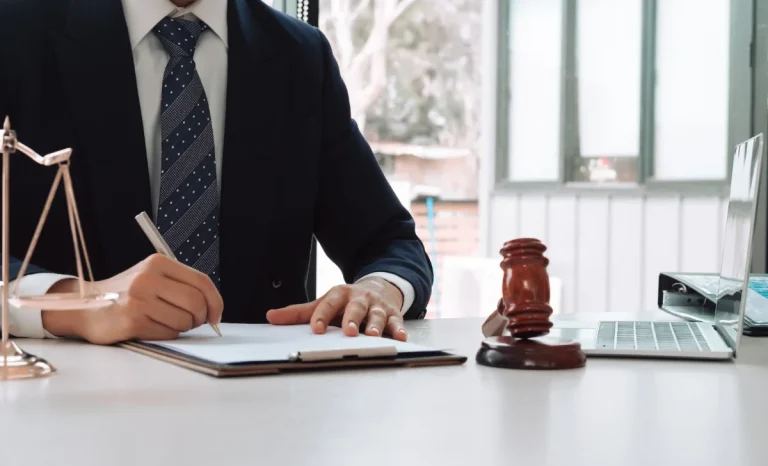 a lawyer in office writing on paper