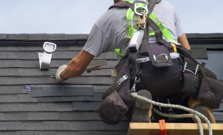 a man repairing damaged roof