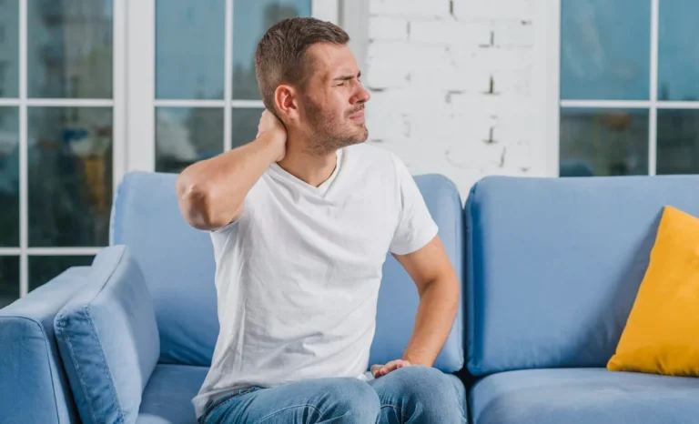 man feeling pain in neck