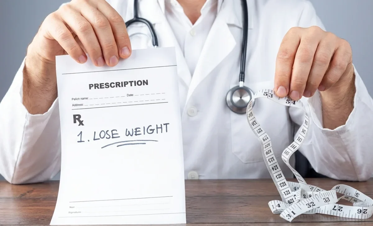 a doctor showing lose weight prescription paper