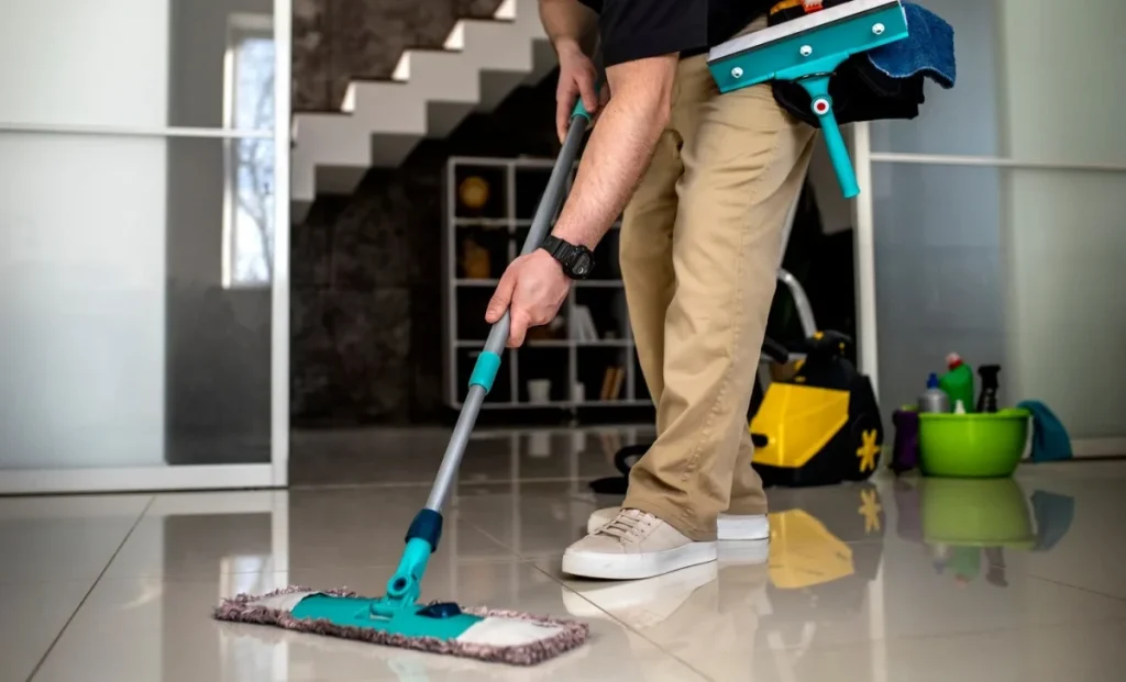 a man cleaning appartement floor