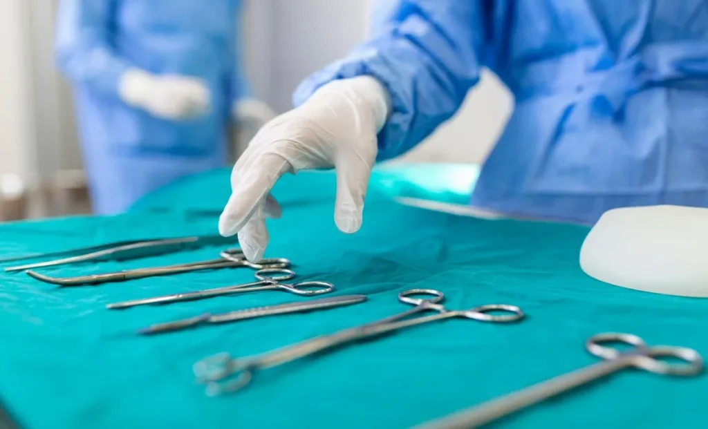 a surgeon picking surgical tools