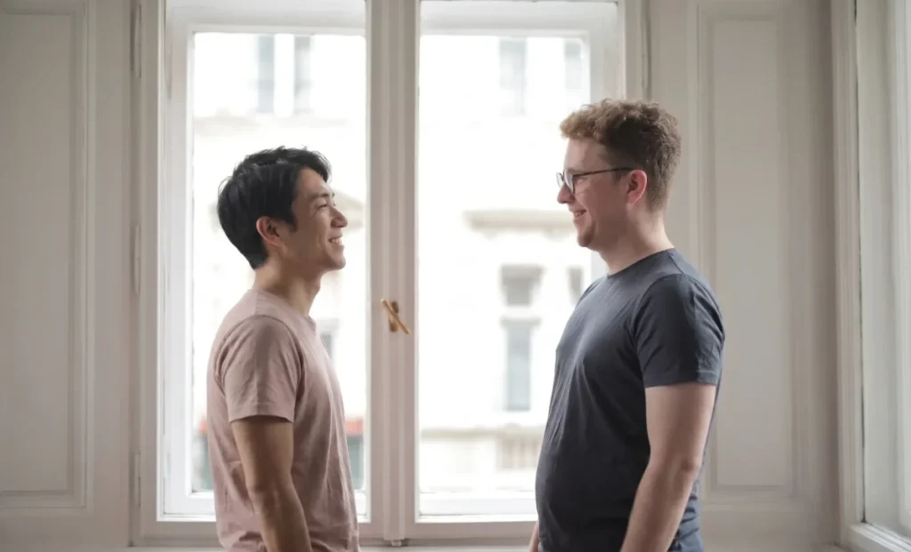 american-man-talking-to-a-japanese-man