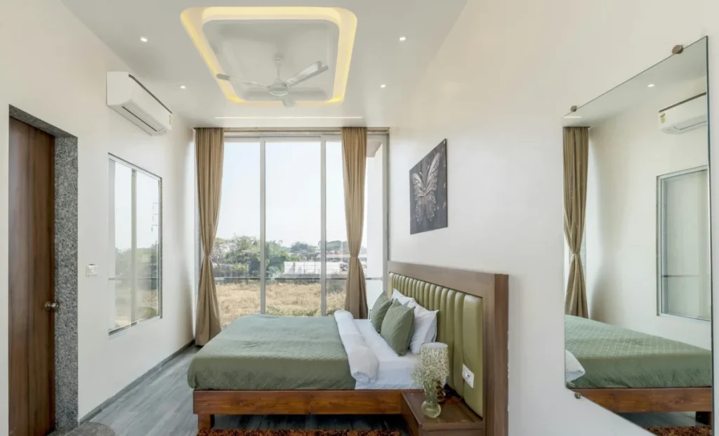 a bedroom with modern ceiling