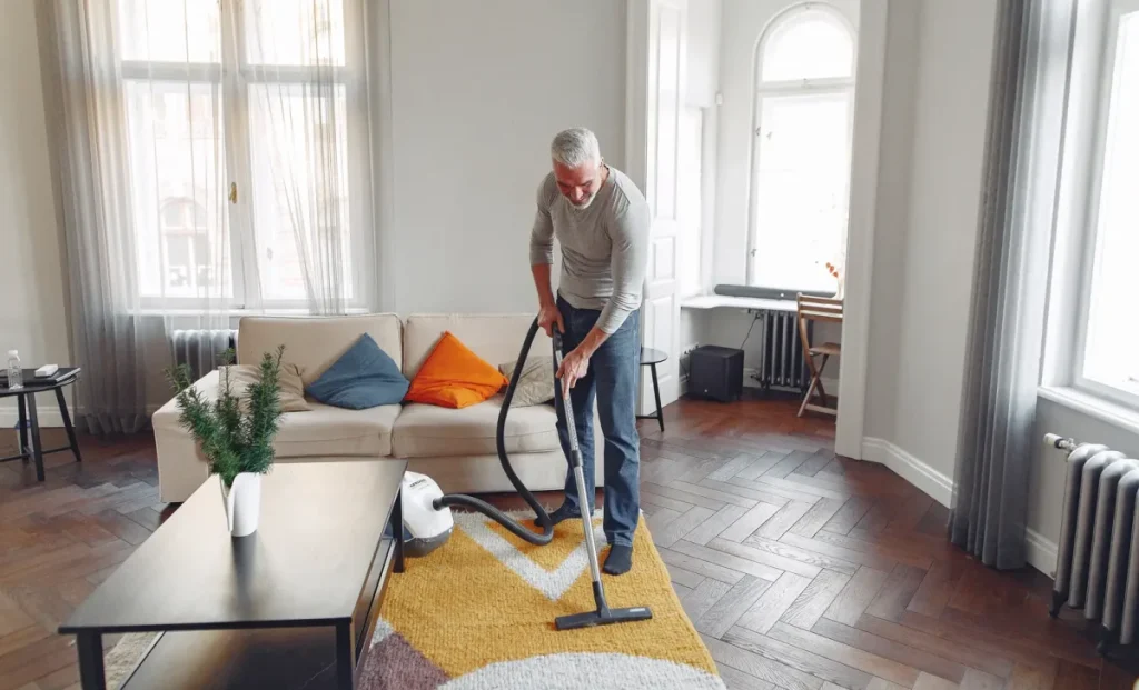 an-old-man-cleaning-carpet