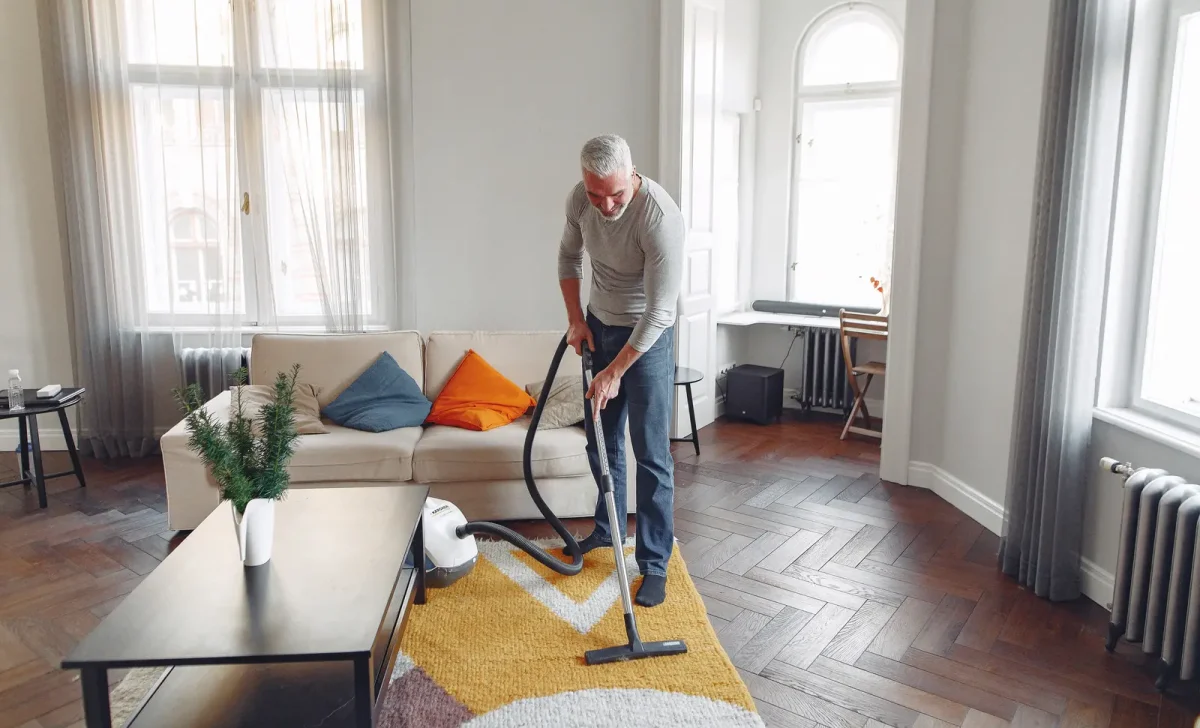 an-old-man-cleaning-carpet
