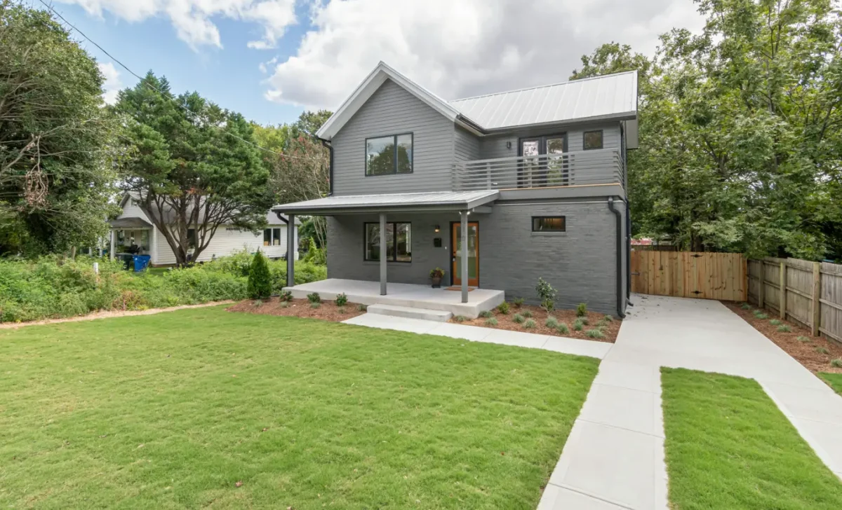concrete-house-with-green-grass-on-the-lawn